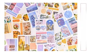 Close-up of vintage scrapbook stickers with floral, sunset and oil painting designs