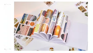 Detailed spread of vintage aesthetic sticker book featuring butterfly and scenery motifs