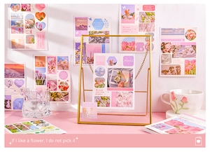 Detail of floral lifestyle stickers with rose and tulip motifs on a gold metal frame