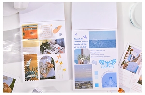 Macro shot of vintage style stickers featuring floral and butterfly motifs for journaling