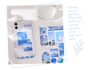 Detail showing blue sky scenery stickers and aesthetic art text for DIY journaling