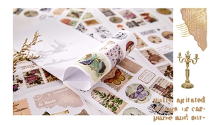 Close-up of vintage butterfly and botanical theme stickers for scrapbooking and DIY crafts