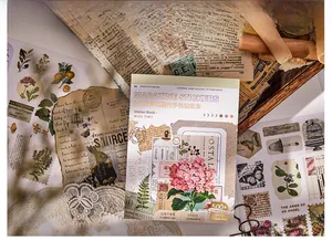 Close-up of vintage butterfly and floral stickers for scrapbooking and journaling