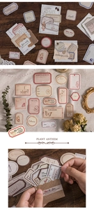 Detailed view of vintage paper stickers for scrapbooking with botanical and retro stamp motifs