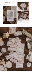 Macro detail of vintage scrapbook stickers with antique luggage tags and floral motifs