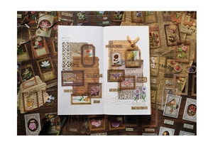 Détails macro d'autocollants floraux vintage et de cadres sur des pages de scrapbooking
