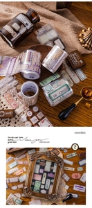Macro detail of vintage PET decorative tape featuring antique labels and stamps for journaling