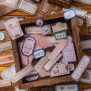 Vintage DIY scrapbooking labels and stickers set on rustic wood for journals