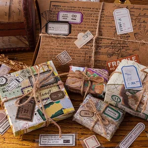Vintage DIY scrapbooking sticker set with retro labels and twine on wooden background