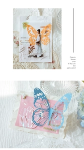 Close-up of hollow butterfly lace paper with silver stamping for journal decoration