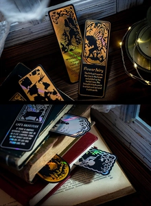 Detailed laser-cut metal bookmarks with rainbow holographic effect and fairy tale designs