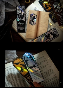 Macro shot of laser holographic bookmark featuring fairytale silhouette and artful design