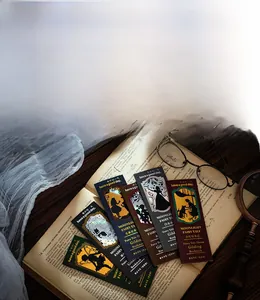 Close-up of Moonlight Fairy Tale gold foil bookmarks with vintage reading accessories