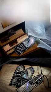 Detailed view of iridescent cat bookmarks with holographic effect on vintage books