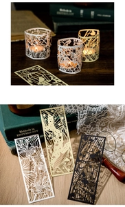 Detailed laser-cut hollow bookmarks featuring floral and birdcage designs on paper