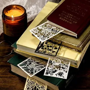 Vintage laser-cut paper bookmarks featuring butterfly and floral silhouette designs
