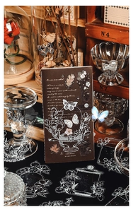 Retro journal setup with vintage paper, floral stickers, and brown aesthetic stationery items
