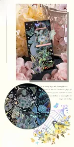 Macro detail of laser silver PET stickers featuring vintage birdcages and butterfly motifs