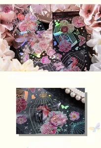 Macro detail of laser PET stickers featuring vintage birdcage, butterflies and floral motifs