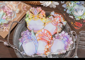Detailed close-up of iridescent PET floral perfume bottle stickers with laser foil effects