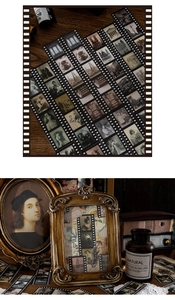 Detail of vintage film strip stickers featuring European art and retro portraits on wood