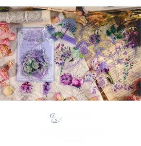 Detail of vintage PET floral stickers in purple tones for scrapbooking decoration