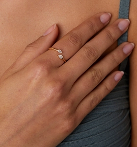Detail of S925 silver open ring with dual pear-cut cubic zirconia stones on hand