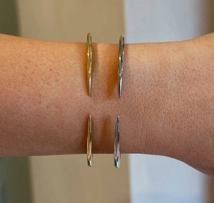 Polished S925 sterling silver open bangles in gold and silver finish on a wrist