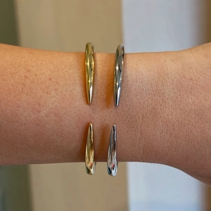 Minimalist S925 sterling silver open bangles in gold and silver finish worn on wrist