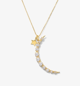 Détail du collier pendentif lune et étoile doré avec cristaux scintillants