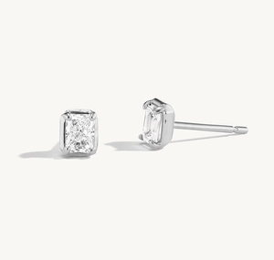 Detail of square zircon S925 sterling silver studs with elegant emerald-cut stones