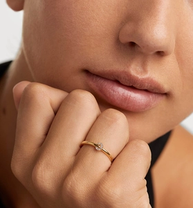 Close-up of S925 silver ring with crystal-encrusted charm worn on model's finger