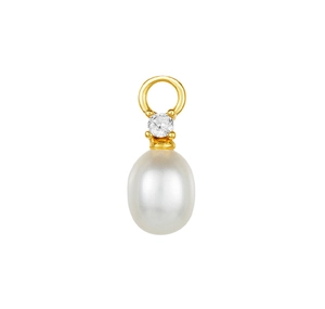 Detail of elegant oval pearl pendant with gold plating and sparkling zircon inlay