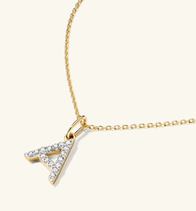Close-up of golden S925 sterling silver letter A pendant with sparkling pave diamonds