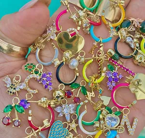 Assorted gold S925 silver earrings with colorful enamel charms and sparkling cubic zirconia