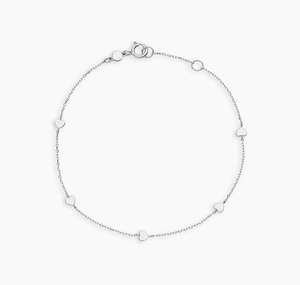 Detailed view of silver heart bracelet with five solid heart charms and lobster clasp