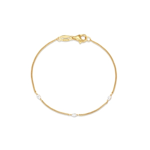 Macro detail of S925 sterling silver stamp and marquise-cut zirconias on gold chain