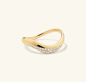 Close-up of irregular wave-shaped ring with pavé-set zircons on gold plated metal