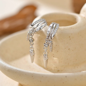 S925 silver double-layer rivet earrings with zircon stones on ceramic stand