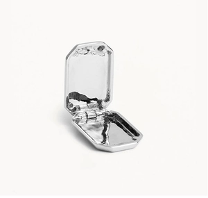 Polished silver square star locket pendant showing the internal compartment storage
