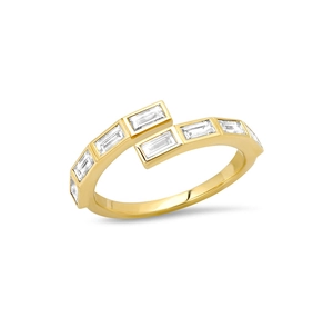 Detail of bypass opening ring in gold finish with baguette-cut white zircon stones