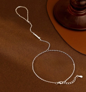 Detail of S925 sterling silver slave bracelet with micro-paved zircon bar and lobster clasp