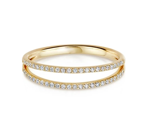 Detail of double-layered gold ring with parallel bands and pavé-set sparkling crystals