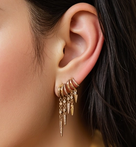 Close-up of gold-plated S925 silver hoop earrings with zircon studs and punk spike pendants