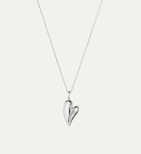 Macro view of a minimalist S925 sterling silver heart pendant with mirror polish