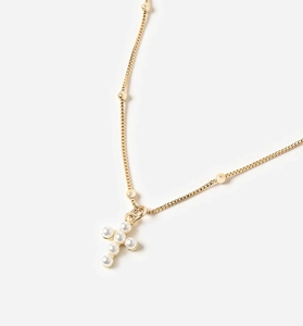 Close-up of elegant gold box chain necklace with cross pendant made of white pearls