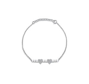Macro detail of S925 sterling silver heart bracelet with sparkling pavé micro-inlays