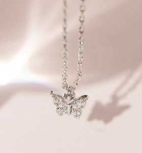 Macro shot of S925 silver butterfly pendant necklace with sparkling pavé cubic zirconia