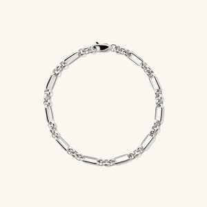 S925 sterling silver Figaro chain bracelet with lobster clasp on a clean minimalist background