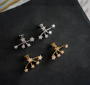 Detail of S925 silver and gold star ear climbers with cubic zirconia micro-pave setting